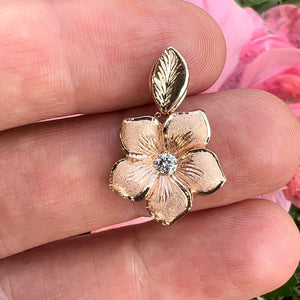 Gold Hawaiian flower pendant with diamond and leaf