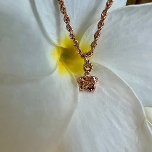 Plumeria charm on a chain in yellow gold