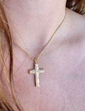 Load image into Gallery viewer, model wearing Scalloped Hibiscus 6mm Cross Pendant in 14K Yellow Gold