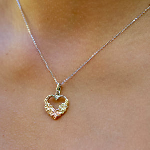 close up of Hawaiian Heart pendant on woman's neck