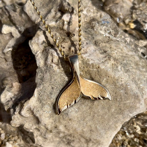 Whale Tail Pendant on a gold chain 