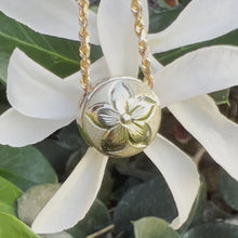 Load and play video in Gallery viewer, two tone Slider pendant with plumeria and hibiscus engraving 
