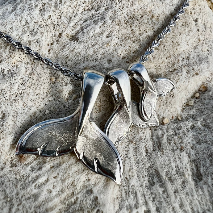 Whale tail pendants on a chain 