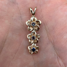 Load image into Gallery viewer, Three Vertical Plumeria Pendant w/ Blue Sapphire and two Alexandrites in 14K Yellow Gold
