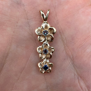 Three Vertical Plumeria Pendant w/ Blue Sapphire and two Alexandrites in 14K Yellow Gold