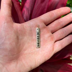 Hawaiian engraved vertical pendant with flower and name 