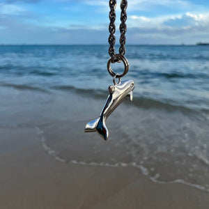 Dolphin charm on a chain in white gold