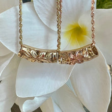 Load image into Gallery viewer, two Hawaiian lei pendants with engraved flower

