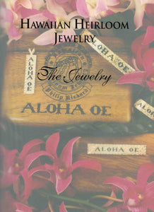 Example of a page from Hawaiian Heirloom Jewelry book with a photograph of Aloha Oe Collection including Hawaiian bracelet, Hawaiian ring, and Hawaiian pendant with Hawaiian lei and Aloha Oe Koa box