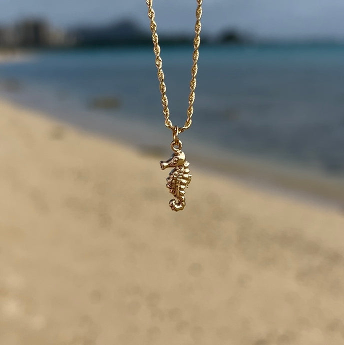 Gold seahorse charm 